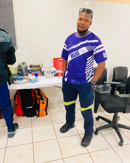 A medic in a 920 shirt in a medical room