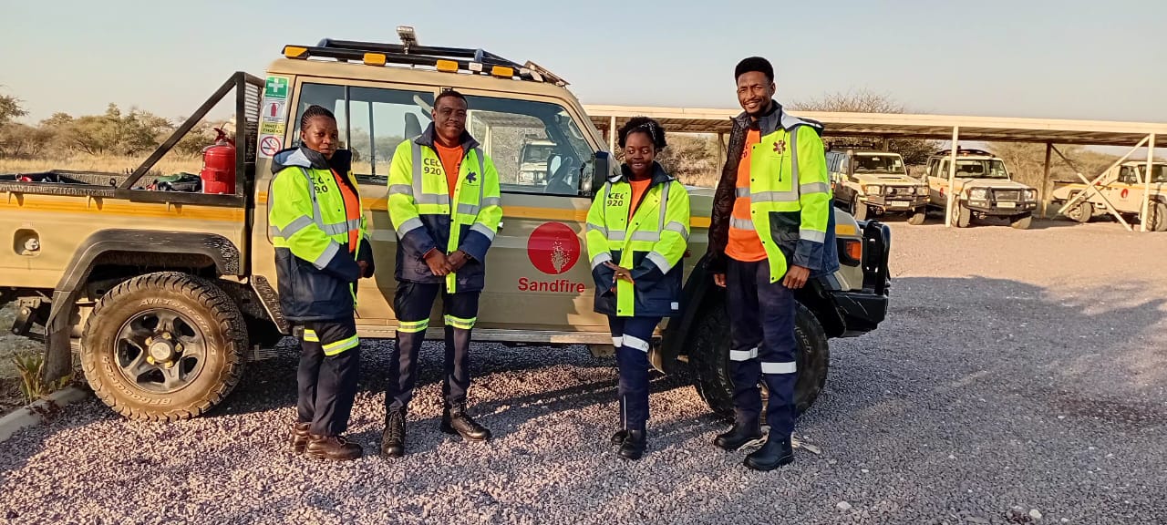 Team with a 4x4 rescue vehicle at a mine site